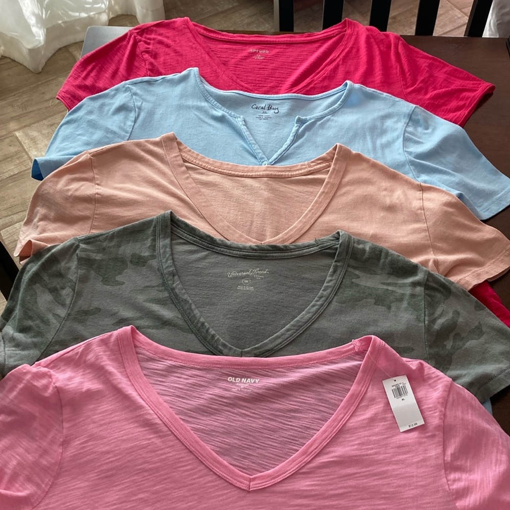 Short sleeved shirts, one of them still with tags.